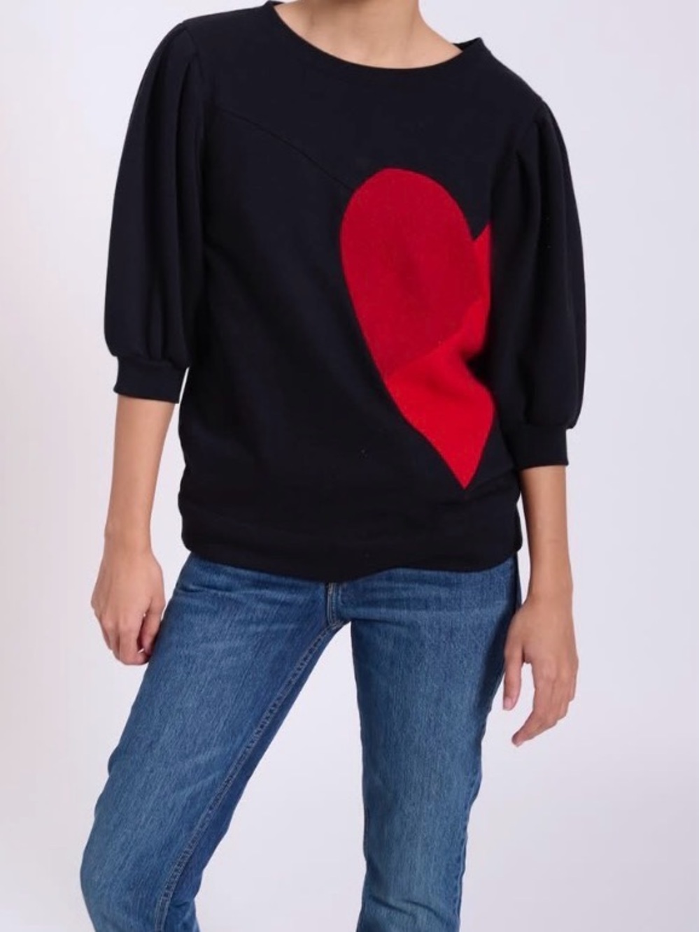 Limited Edition Black Sweatshirt with Red Heart Graphic and puffed sleeves.